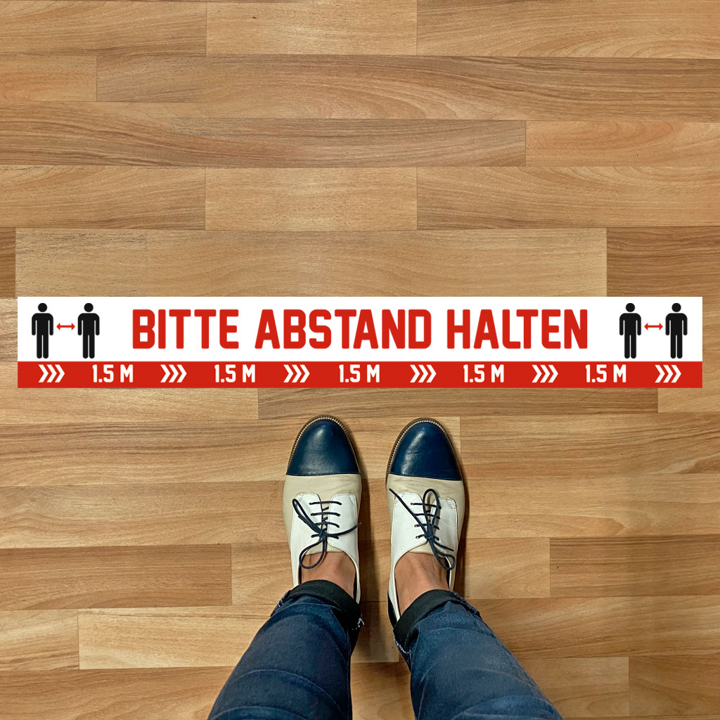 Fußbodenaufkleber „Bitte Abstand halten“