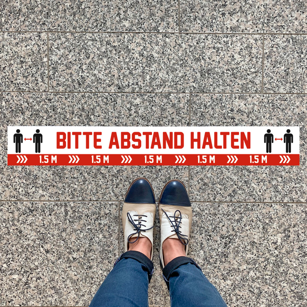 Fußbodenaufkleber „Bitte Abstand halten“